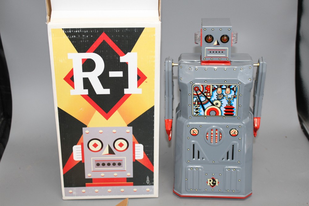Four collectors robots, various, including a Rocket Toys R-1,